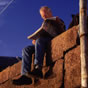 Man reading paper on wall in North Berwick