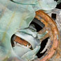 The melted window of a burnt out car