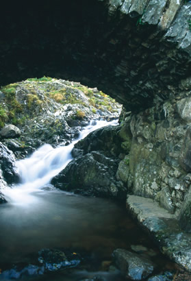 Stream running under Lake District bridge
