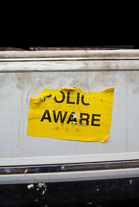 Police aware sticker on burnt out limo