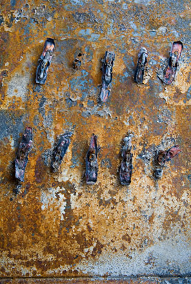 Rusty panel in a burnt out limo